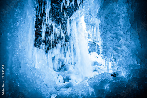 Ice cave in frozen waterfall Jagala, Estonia
