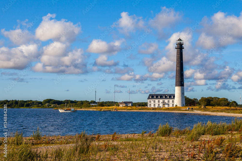 Sorve lighthouse against blue sky, Saaremaa island, Estonia. Long and thin peninsula