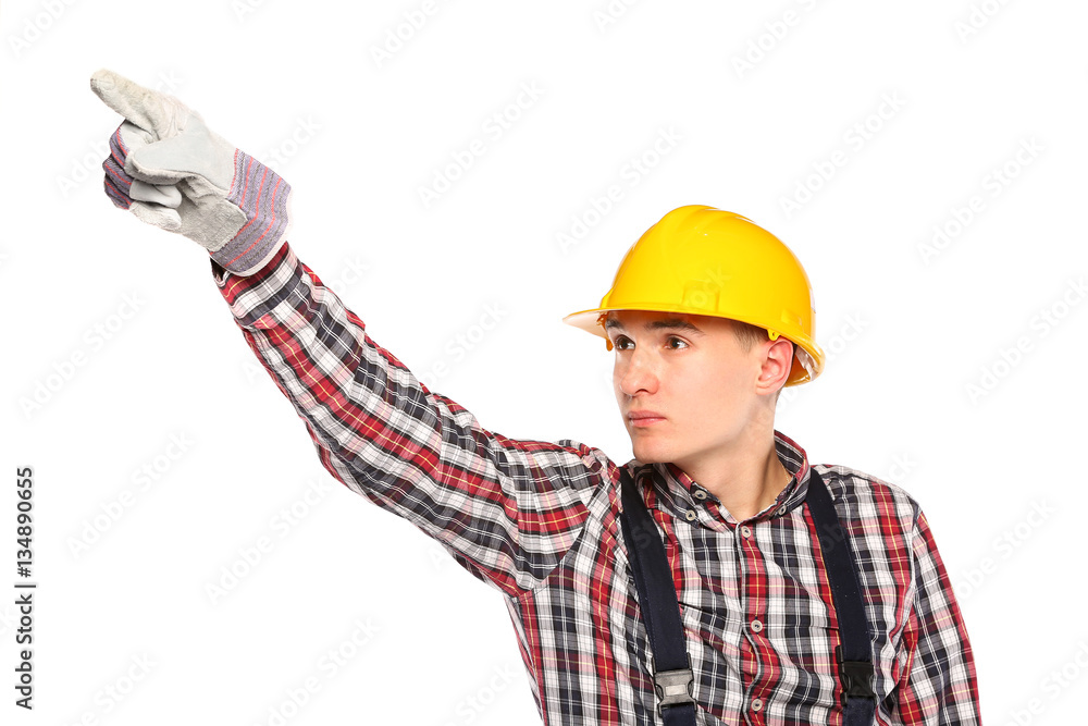 young worker with yellow and workers gloves pointing upward young worker with yellow and workers gloves pointing upward