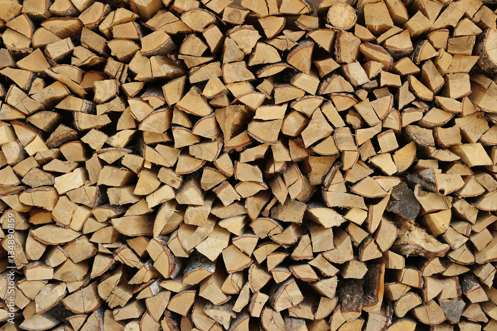 A background picture of a pile of chopped firewood A background picture of a pile of chopped firewood