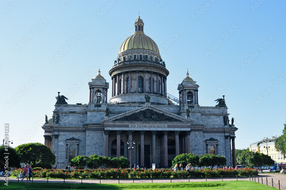 St. Isaac's Cathedral and red roses on the square bright Sunny d