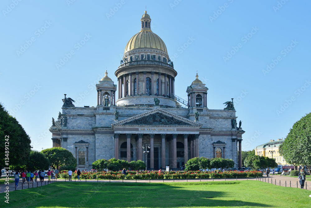 St. Isaac's Cathedral, green lawn and red roses on the square br