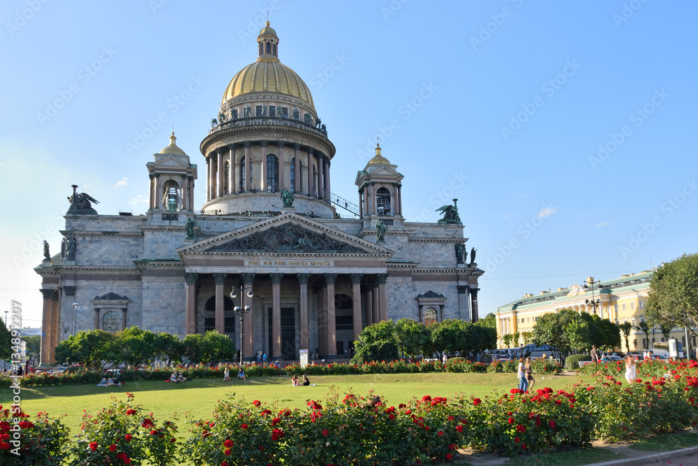 St. Isaac's Cathedral on a background of red roses on the square