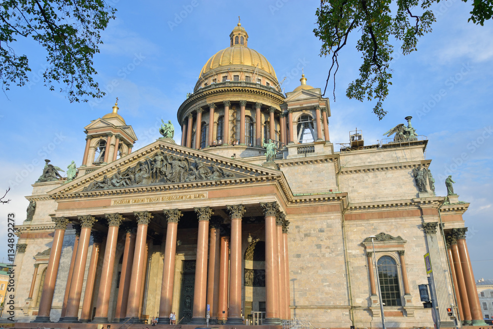 Views of the towering St. Isaac's Cathedral in summer in the sun
