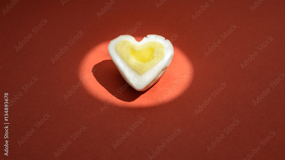 Egg heart on red. Romantic background concept Egg heart on red. Romantic background concept