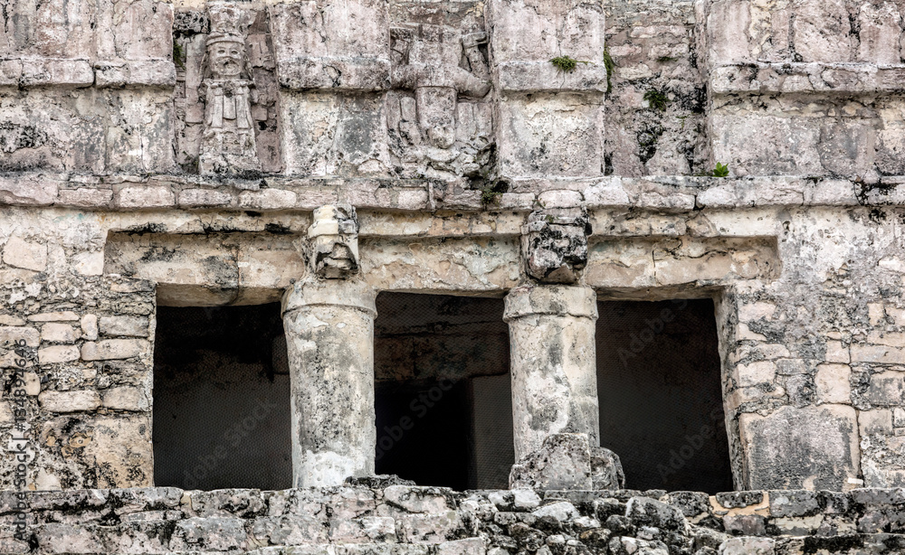 Details of the facade of the ancient Mayan Pyramid El Castillo (The Castle) in the Tulum Archaeological Zone, Quintana Roo, Mexico