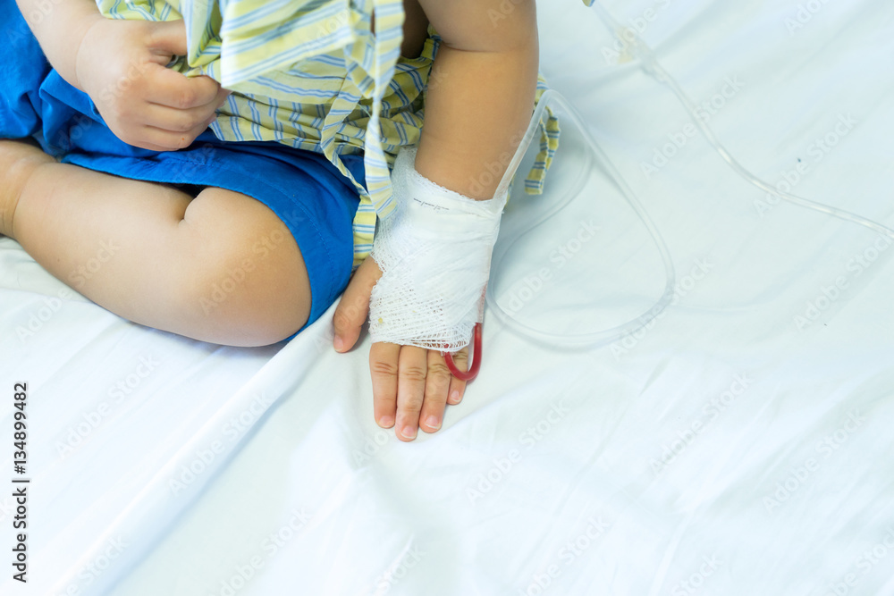 Asian baby in the hospital with saline intravenous Asian baby in the hospital with saline intravenous