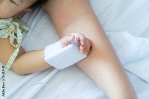Asian baby in the hospital with saline intravenous