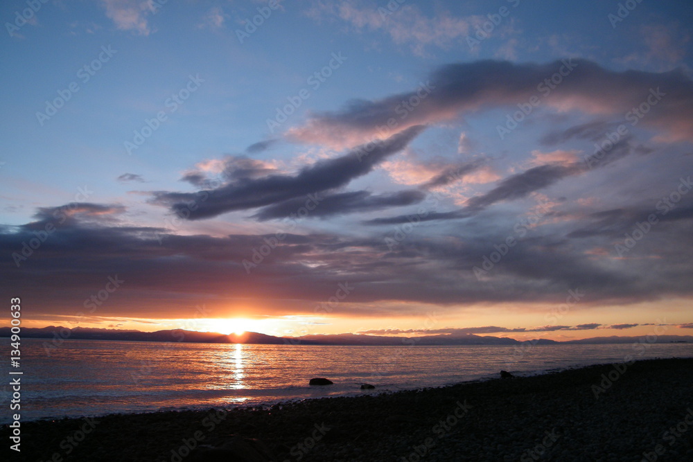 Obraz premium Sunset on the Ocean with Clouds