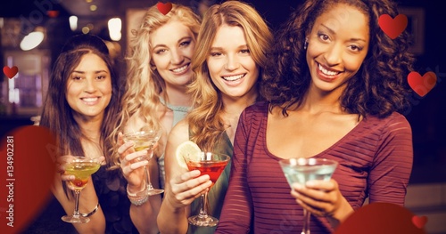 Composite image of portrait of friends having a drink