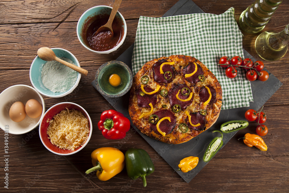 Delicious pizza served on wooden table Delicious pizza served on wooden table