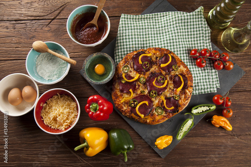 Delicious pizza served on wooden table