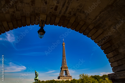 Eiffel Tower reveled from under Bir-Hakeim bridge in Paris, France © kwphotog