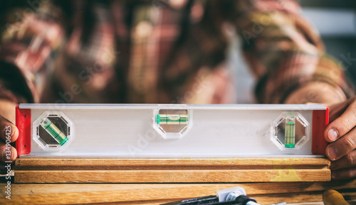 Carpenter working with a spirit level