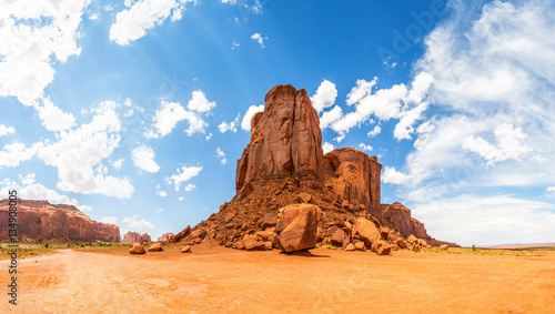 Desert, sandstone mountains and cloudy sky photo
