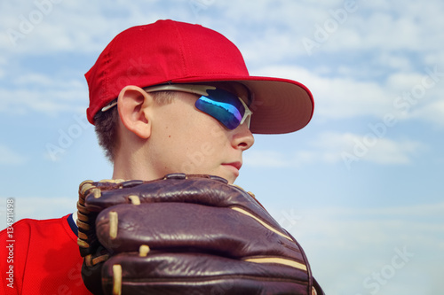 Closeup of a boy pitcher, focus on side of boys face.