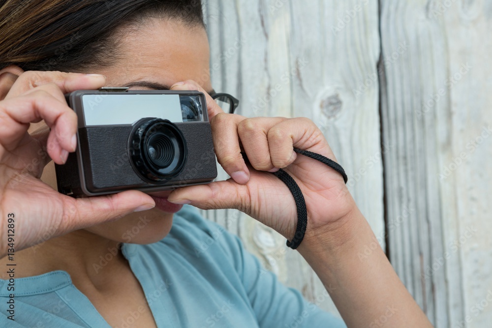 Female photographer with old fashioned camera Female photographer with old fashioned camera