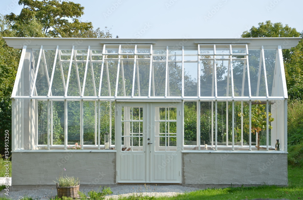 Fototapeta premium a small greenhouse in a tiny village in Sweden