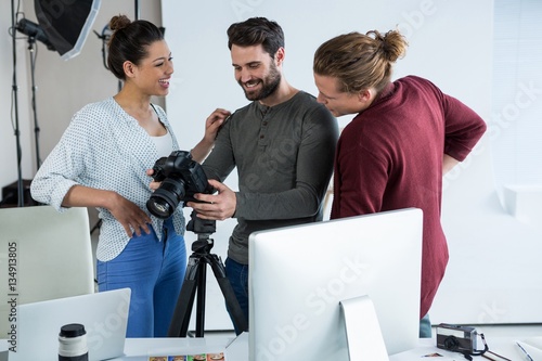 Photography Photographers and model reviewing photos