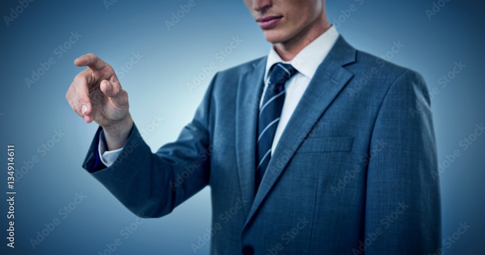Composite image of midsection of elegant businessman pointing Composite image of midsection of elegant businessman pointing