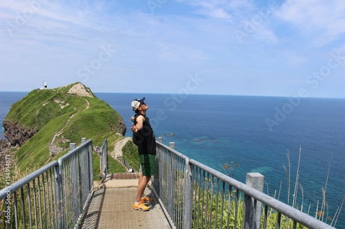 神威岬（かむいみさき）と男性 photo