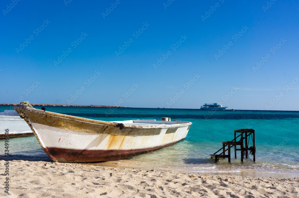 A boat moored to the shore. Beautiful view from the Paradise Island near Hurghada to Red Sea