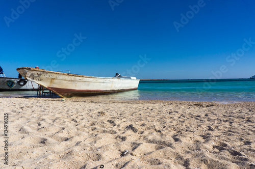 A boat moored to the shore. Beautiful view from the Paradise Island near Hurghada to Red Sea