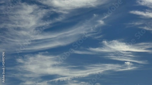 Feathery Cirrus Clouds Drift Overhead photo