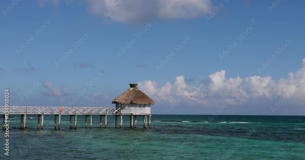 Mexico beautiful Caribbean Ocean pier and cabana. Luxury resort on Mexican Mayan Riviera near Cancun. Romantic destination. Caribbean ocean destination for vacation and business. Mexico beautiful Caribbean Ocean pier and cabana. Luxury resort on Mexican Mayan Riviera near Cancun. Romantic destination. Caribbean ocean destination for vacation and business.