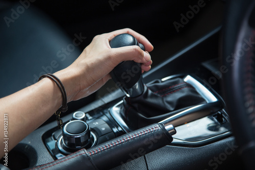 girl driving car moving transmission shift gear