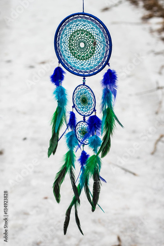 Dreamcatcher made of feathers, leather, beads, and ropes