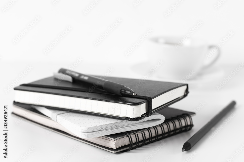 Stack of notepads and coffee Stack of notepads and coffee