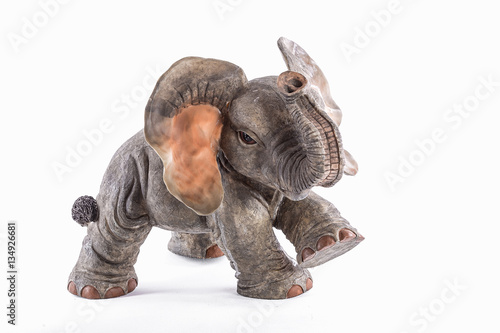 stone sculpture of an African elephant isolated on white background