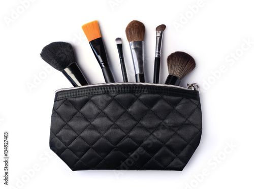 Black cosmetic bag with brushes for make-up