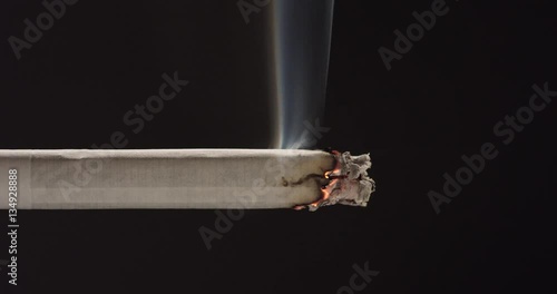 Tip of cigarette burning, close up