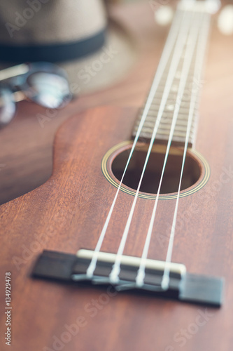 Ukulele guitar on wooden table