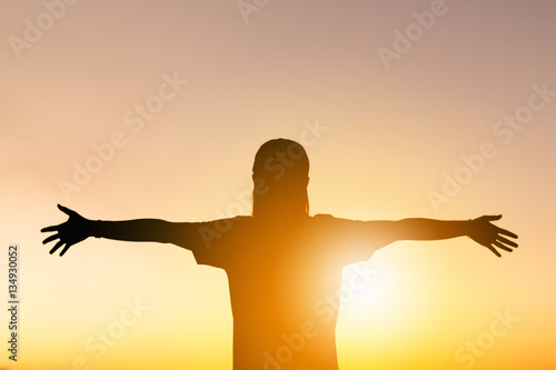 Silhouette of Woman Celebration Success Happiness Relaxed at Evening Sky Sunset Background, Sport and Active life Concept.