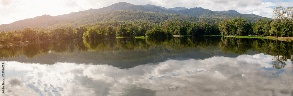 Beautiful panoramic summer landscape in the mountains with the sun at dawn. Beautiful panoramic summer landscape in the mountains with the sun at dawn.