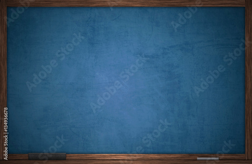 Blue chalkboard in wooden frame with chalk and eraser photo