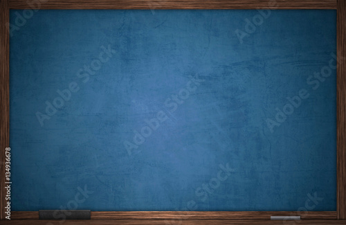 Blue chalkboard in wooden frame with chalk and eraser