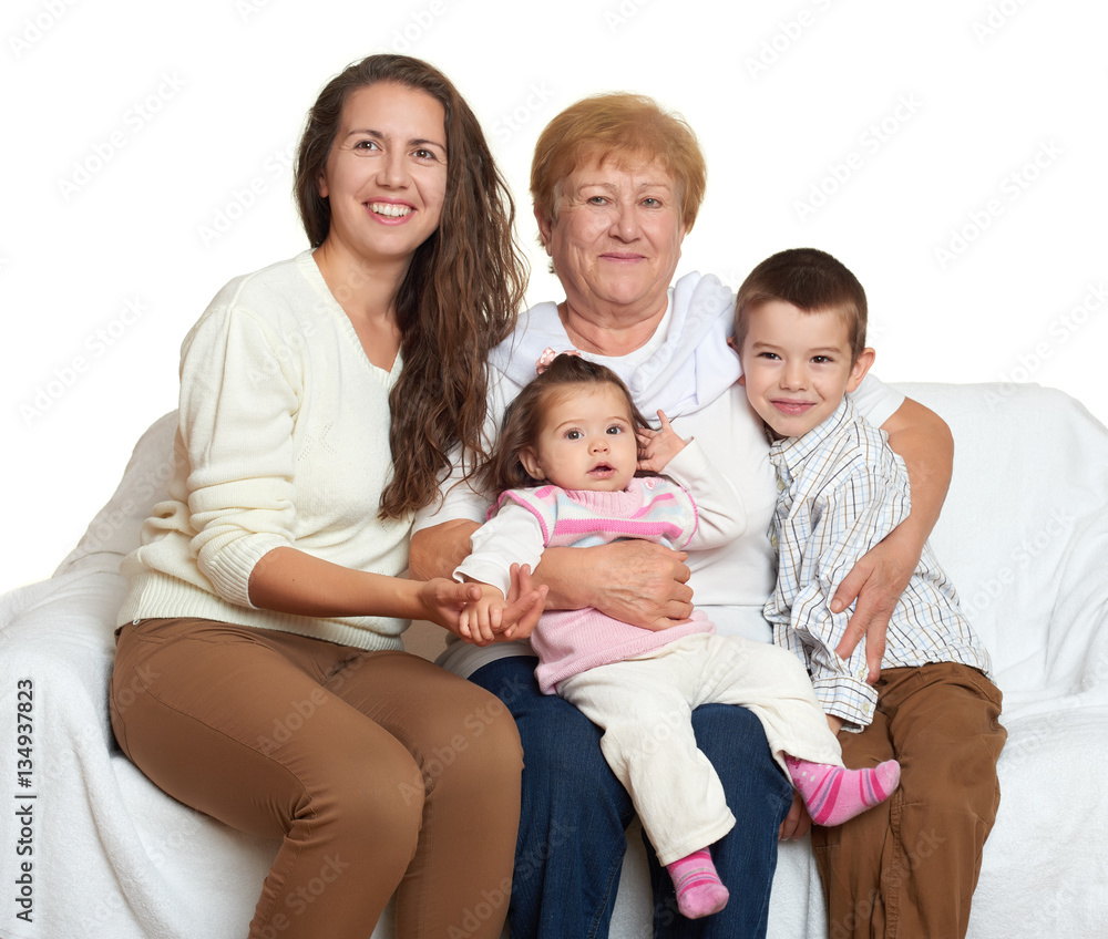 Family portrait on white background, happy people sit on sofa. Children with mother and grandmother Family portrait on white background, happy people sit on sofa. Children with mother and grandmother