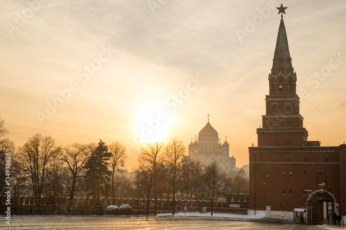 Borovitsky tower and gate of Moscow Kremlin and Christ the Savior cathedral at sunset  