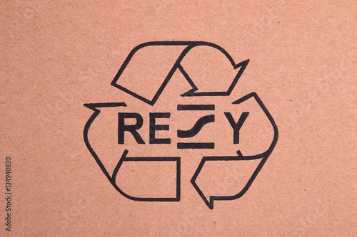Black recycle symbol on cardboard photo