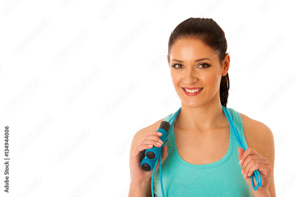 Beautiful young woman working out with speed rope isolated over Beautiful young woman working out with speed rope isolated over
