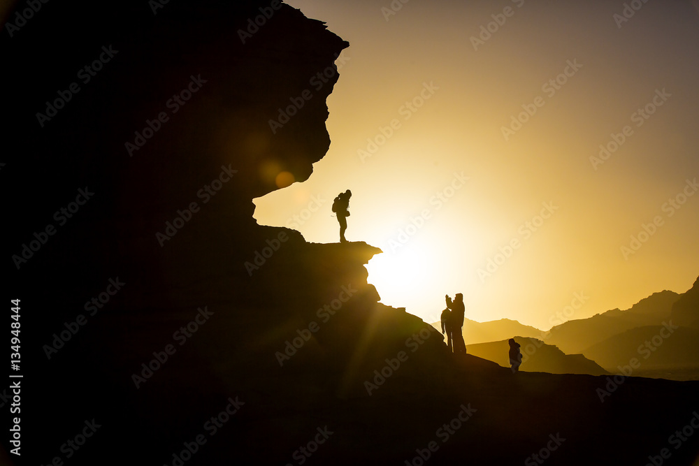 Silhouette of a man on a rock 