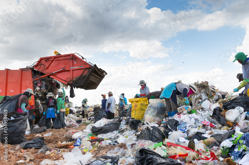 People collect gabage from  Removal and landfill waste from indu