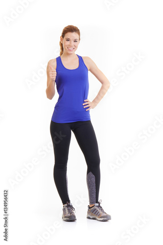 Isolated young fitness woman show ok