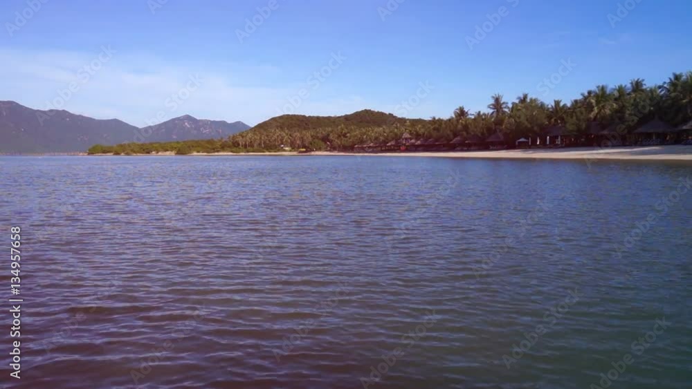 Beautiful scenery from the ship. Ocean, tropical islands, mountains covered with forests. Beautiful scenery from the ship. Ocean, tropical islands, mountains covered with forests.