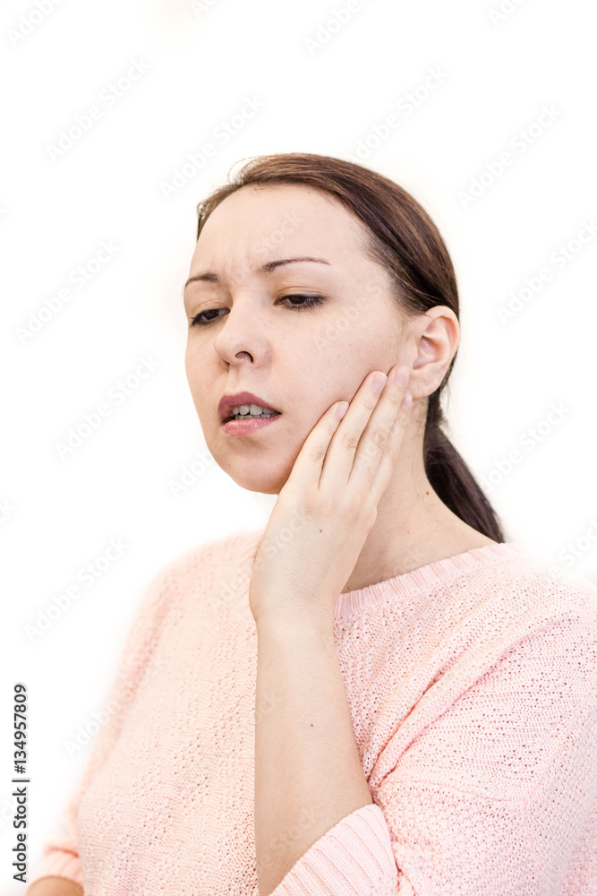 Closeup of young woman suffering from toothache at home. Terrible Strong Teeth Pain, Touching Cheek With Hand. Female Feeling. Dental Care And Health Concept.