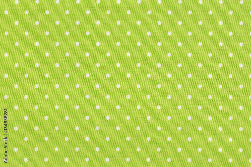 White dot over yellow polka dot fabric background and texture. White dot over yellow polka dot fabric background and texture.